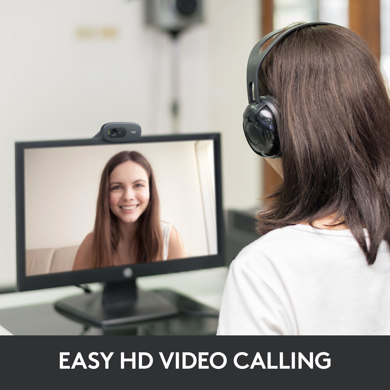 Logitech C270 HD webcam lifestyle shot mounted on monitor showing person on video call