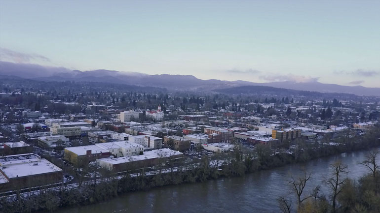 flying a drone with camera gear over town