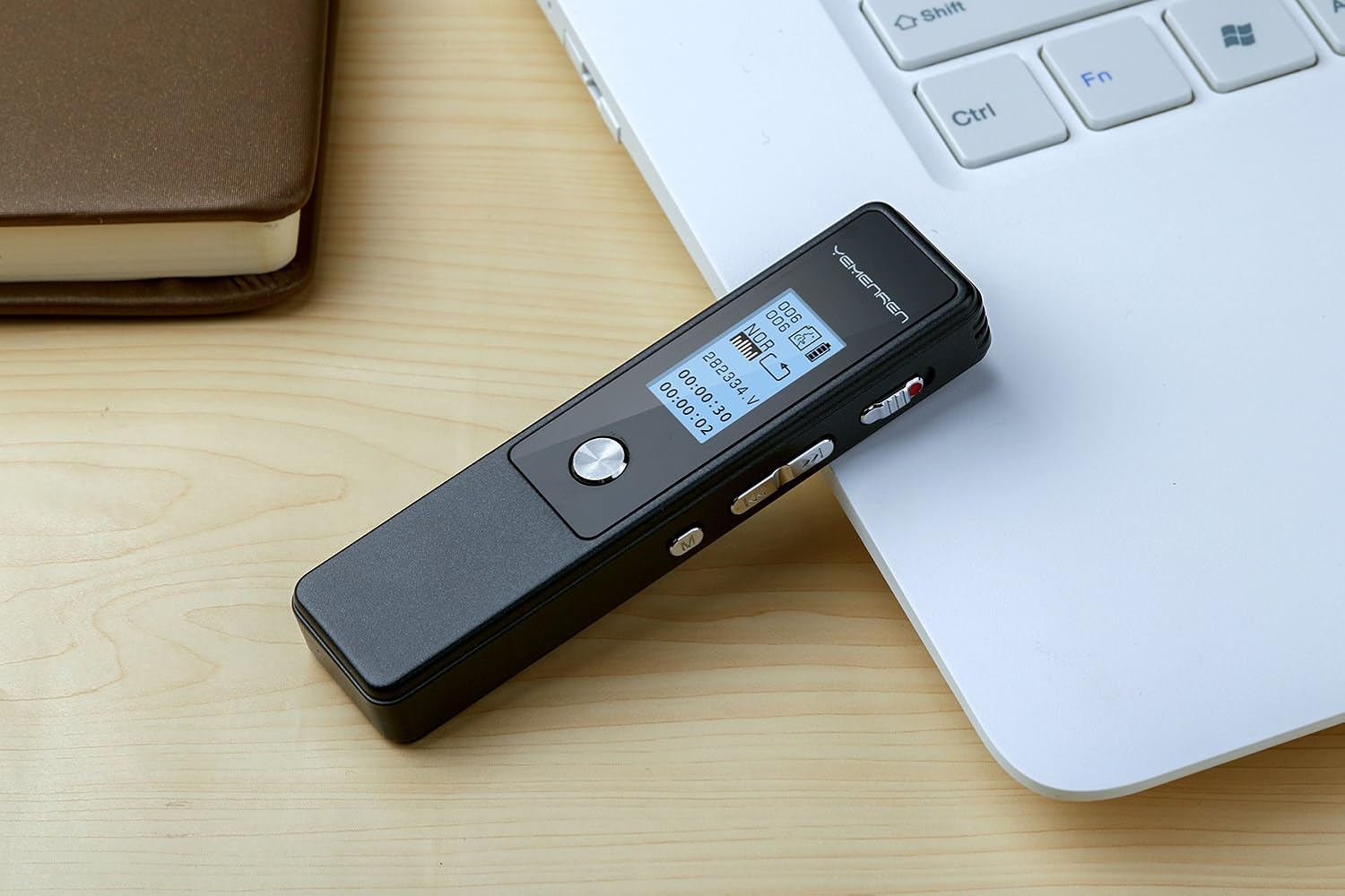 Yemenren 8GB voice recorder on a wooden desk next to a laptop